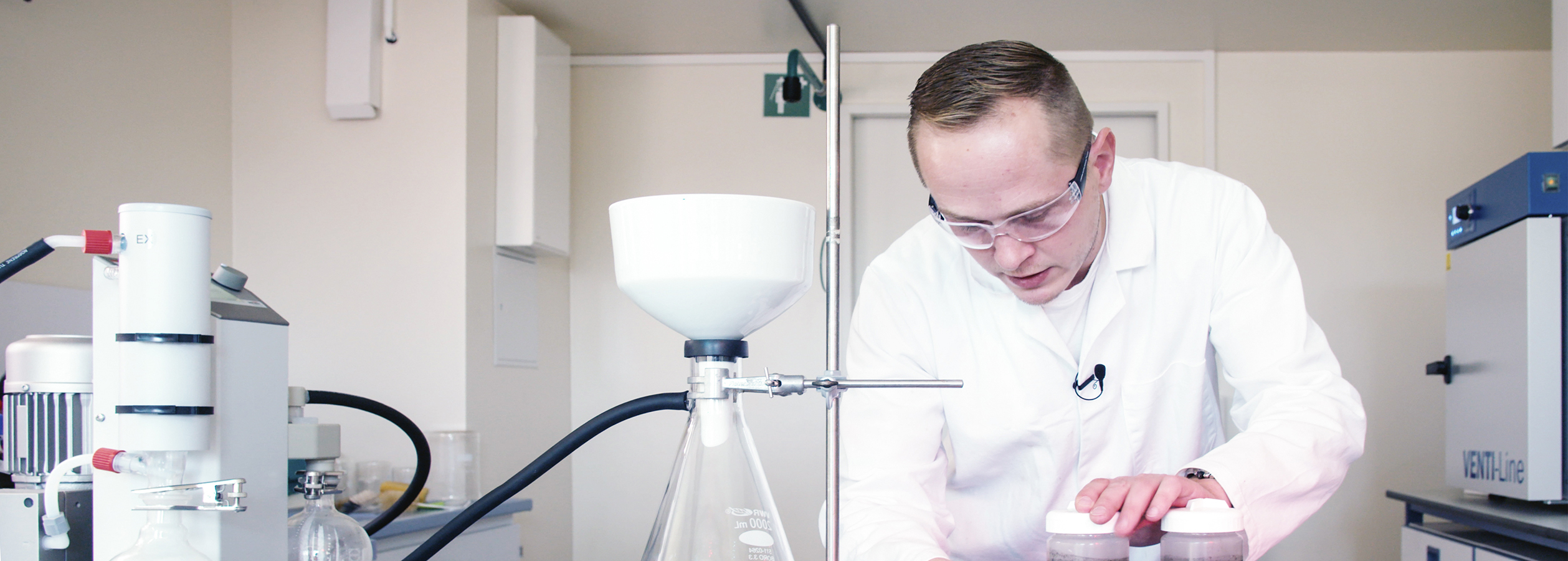 Man in white coat in laboratory